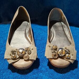 Coach Tan Flats with Gold Embellishments